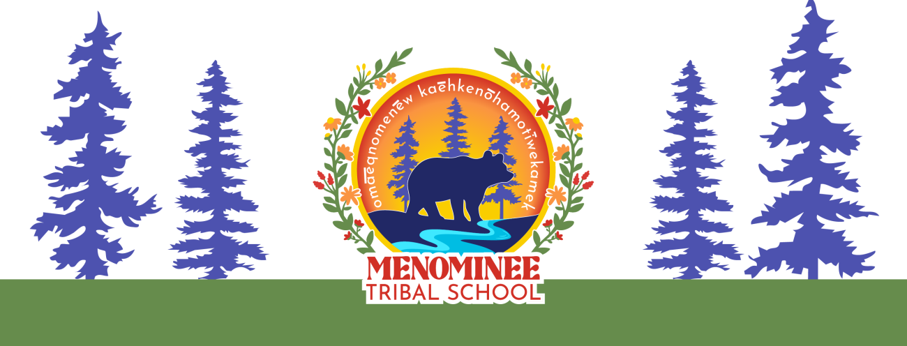 Logo for Menominee Tribal School featuring a bear silhouette standing by a river with pine trees in the background, surrounded by a circular border with floral decorations. The text “Menominee Tribal School” appears below, and Menominee language text is written around the top of the circle.